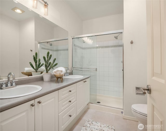 16125 Juanita Woodinville Way NE Unit 1807, Bothell, WA 98011 - bathroom with tile patterned floors, a shower stall, and double vanity