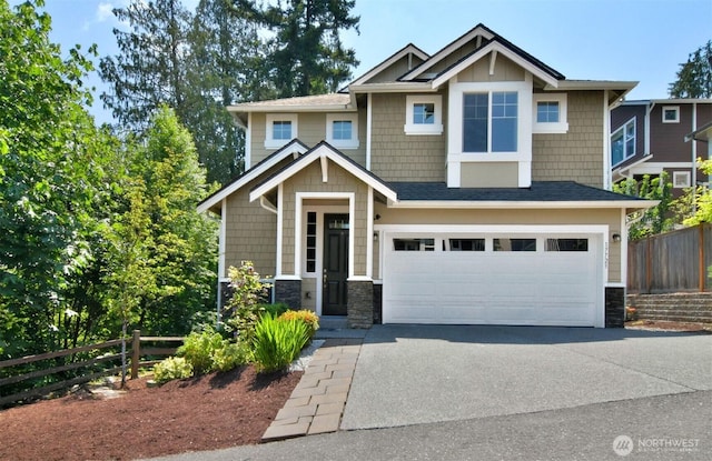 17723 3rd Ave SE, Bothell, WA 98012 - craftsman-style home with stone siding, an attached garage, and asphalt driveway