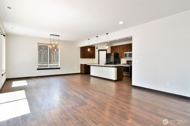 17723 3rd Ave SE, Bothell, WA 98012 - unfurnished living room with a chandelier, dark wood-style floors, and recessed lighting