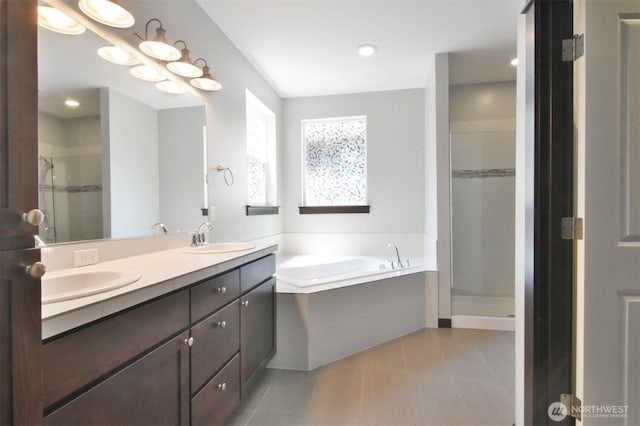 17723 3rd Ave SE, Bothell, WA 98012 - full bathroom with a garden tub, double vanity, a shower stall, tile patterned floors, and recessed lighting