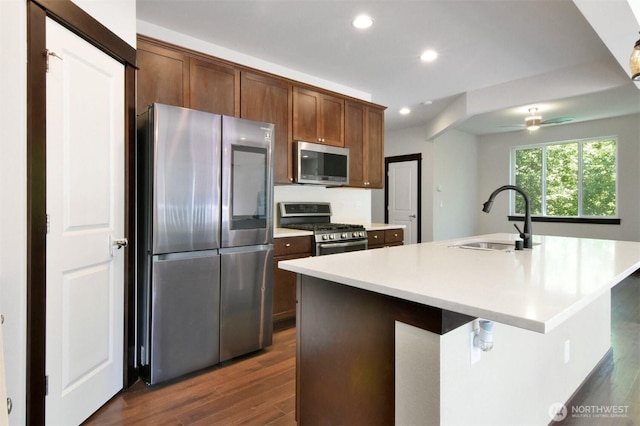 17723 3rd Ave SE, Bothell, WA 98012 - kitchen with stainless steel appliances, dark wood-style flooring, ceiling fan, recessed lighting, and light countertops