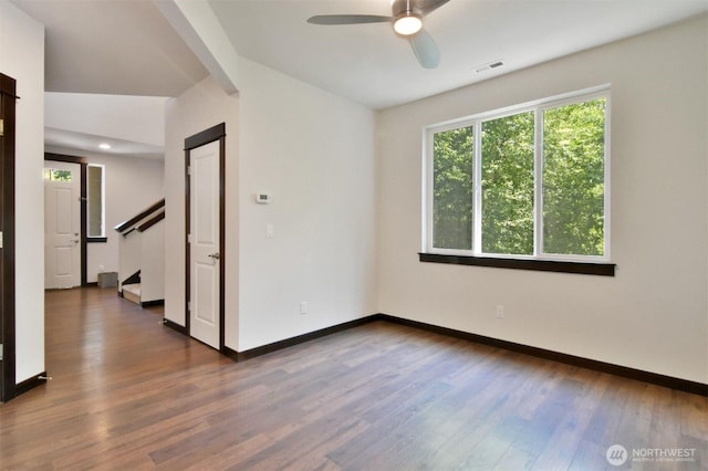 17723 3rd Ave SE, Bothell, WA 98012 - empty room featuring a ceiling fan, stairs, and wood finished floors