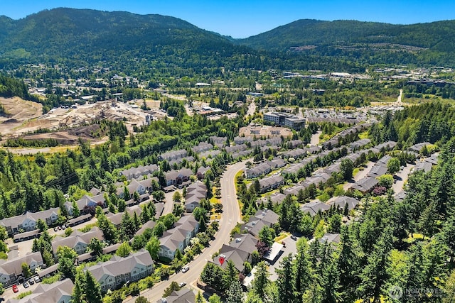 23420 SE Black Nugget Rd Unit E-302, Issaquah, WA 98029 - aerial view of property's location with mountains and nearby suburban area