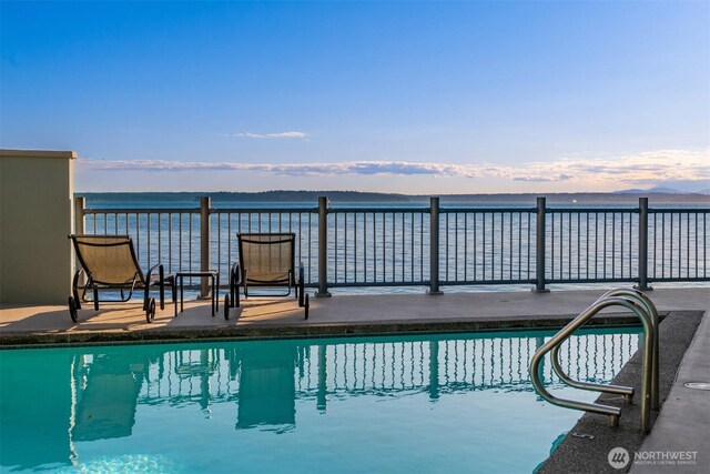 3717 Beach Dr SW Unit 113, Seattle, WA 98116 - view of pool featuring a patio area and a water view