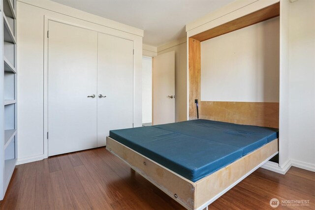 3717 Beach Dr SW Unit 113, Seattle, WA 98116 - bedroom featuring wood finished floors and a closet