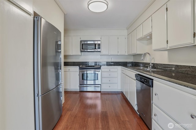 3717 Beach Dr SW Unit 113, Seattle, WA 98116 - kitchen featuring appliances with stainless steel finishes, white cabinetry, and dark wood finished floors