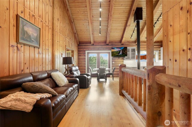 4004 Saje Ln, Sedro Woolley, WA 98284 - living room with rail lighting, wood ceiling, wood finished floors, and wooden walls