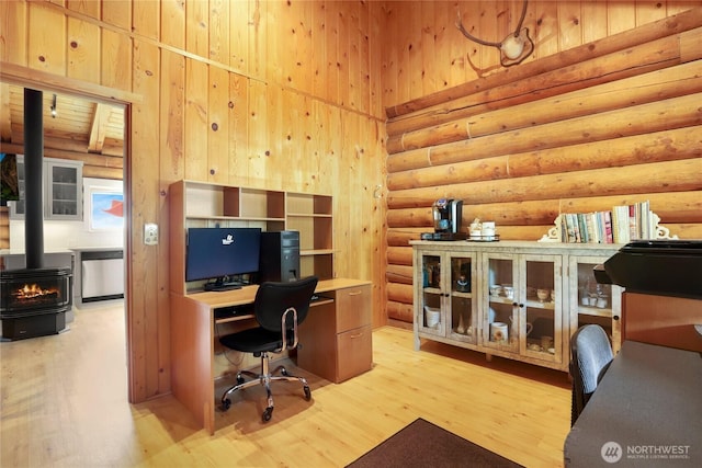4004 Saje Ln, Sedro Woolley, WA 98284 - home office with log walls, a wood stove, and light wood-style floors
