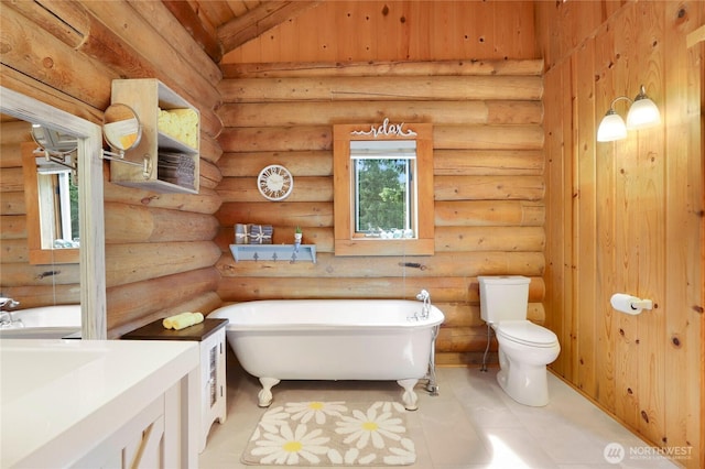 4004 Saje Ln, Sedro Woolley, WA 98284 - full bathroom featuring a freestanding tub, vanity, a wall unit AC, tile patterned flooring, and log walls