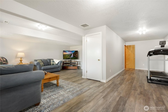 4004 Saje Ln, Sedro Woolley, WA 98284 - living area featuring wood finished floors and a textured ceiling
