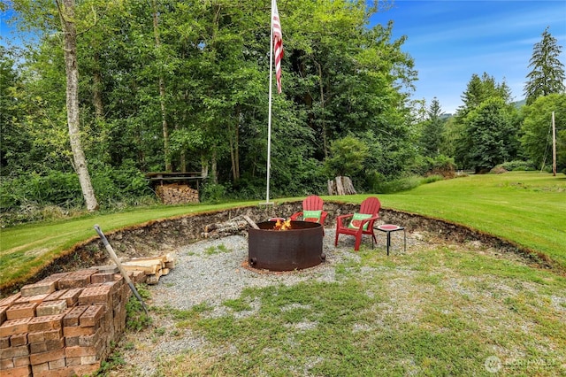 4004 Saje Ln, Sedro Woolley, WA 98284 - view of green lawn with an outdoor fire pit