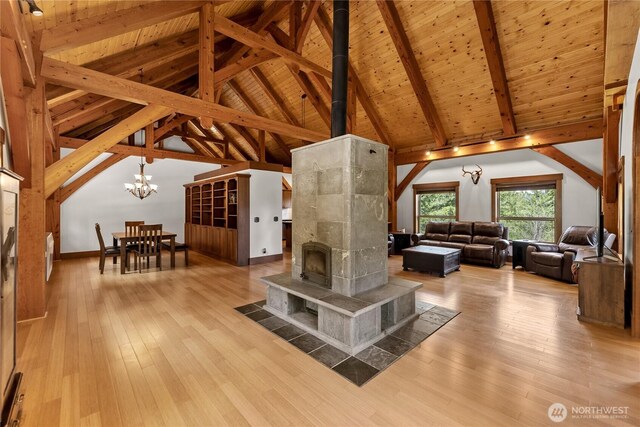 65 Fiddlers Rd, Winthrop, WA 98862 - living room featuring hardwood / wood-style floors, a chandelier, a wooden ceiling with exposed beams, and high vaulted ceiling