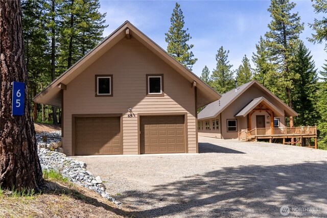 65 Fiddlers Rd, Winthrop, WA 98862 - chalet / cabin featuring a deck and a detached garage