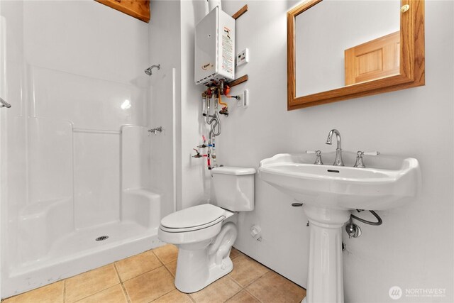 65 Fiddlers Rd, Winthrop, WA 98862 - full bath featuring tile patterned flooring, tankless water heater, and a shower