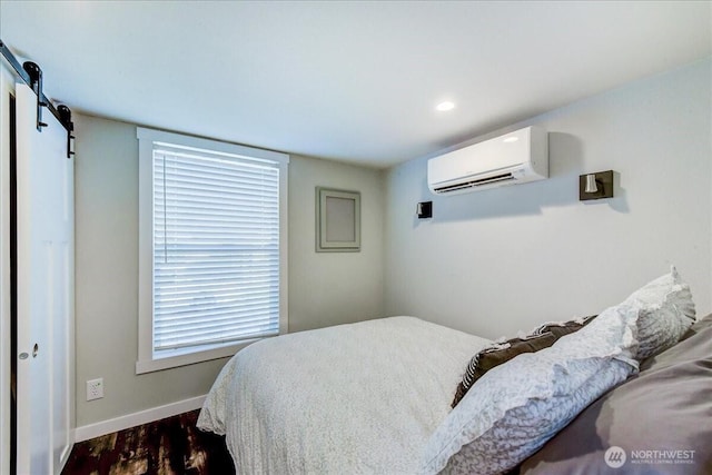 8542 Crescent Bar Rd NW Unit 346, Quincy, WA 98848 - bedroom with a wall mounted AC and dark wood finished floors