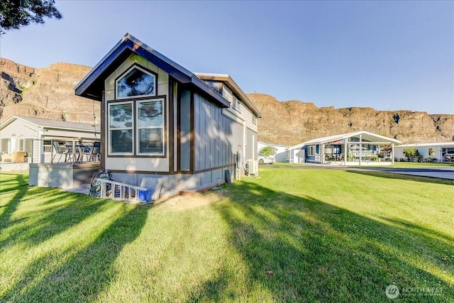 8542 Crescent Bar Rd NW Unit 346, Quincy, WA 98848 - view of property exterior with a mountain view and a lawn