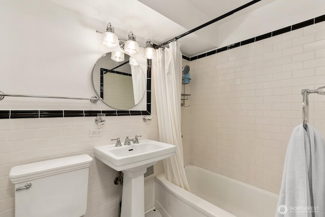 1105 Spring St Unit 1106, Seattle, WA 98104 - full bathroom featuring shower / bath combo with shower curtain and tile walls
