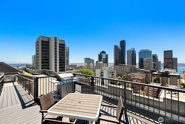 1105 Spring St Unit 1106, Seattle, WA 98104 - deck featuring a view of skyline and area for grilling