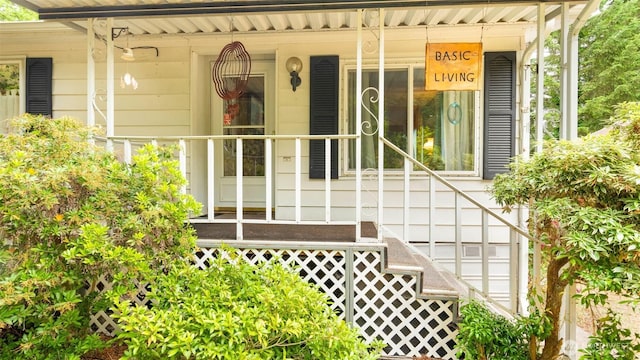 20 NE Wanda Ct, Belfair, WA 98528 - doorway to property featuring covered porch