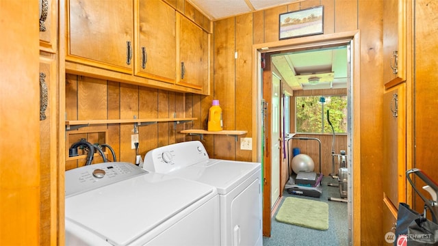 20 NE Wanda Ct, Belfair, WA 98528 - laundry area with cabinet space, washing machine and dryer, wood walls, and carpet flooring