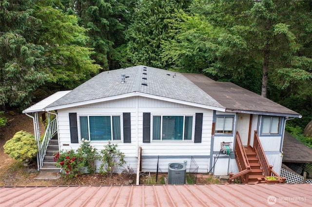 20 NE Wanda Ct, Belfair, WA 98528 - view of front of house featuring stairs and roof with shingles
