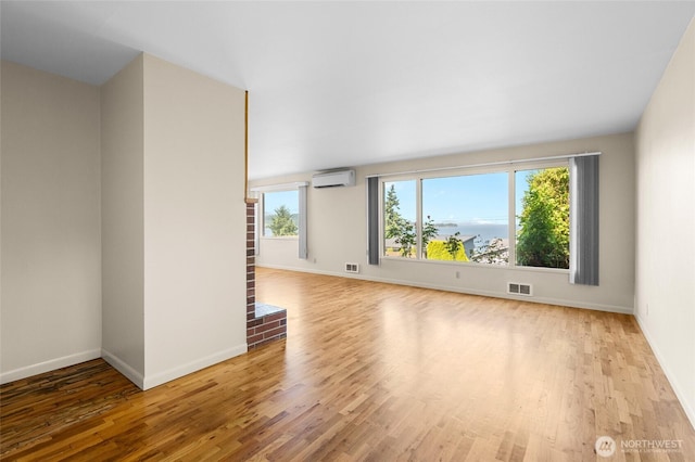 2834 Leeward Way, Bellingham, WA 98226 - spare room with an AC wall unit and wood finished floors