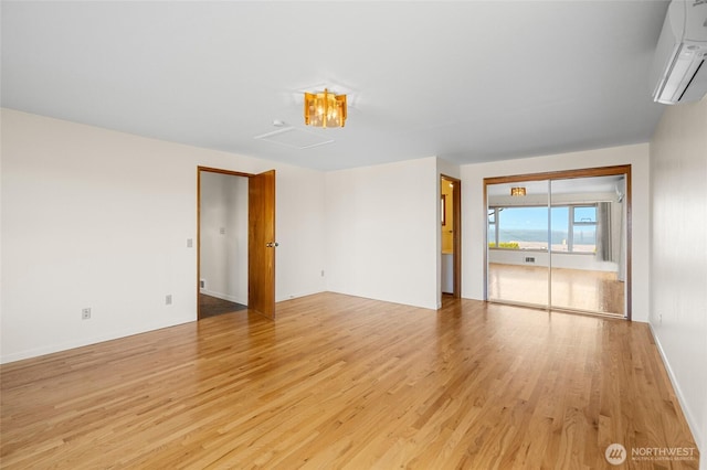 2834 Leeward Way, Bellingham, WA 98226 - unfurnished room with a wall mounted AC and light wood finished floors