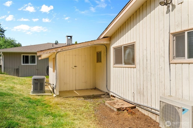 2834 Leeward Way, Bellingham, WA 98226 - rear view of house with a chimney and a yard