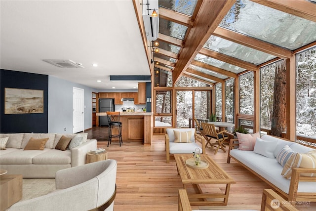11358 River Bend Dr, Leavenworth, WA 98826 - living room with plenty of natural light, light wood-style flooring, lofted ceiling, and recessed lighting