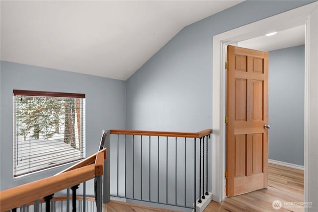 11358 River Bend Dr, Leavenworth, WA 98826 - corridor featuring an upstairs landing, vaulted ceiling, and wood finished floors