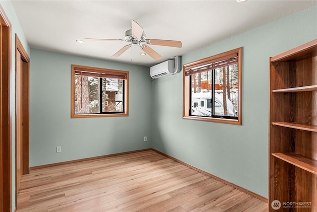 11358 River Bend Dr, Leavenworth, WA 98826 - unfurnished bedroom with a wall mounted AC, multiple windows, wood finished floors, and recessed lighting