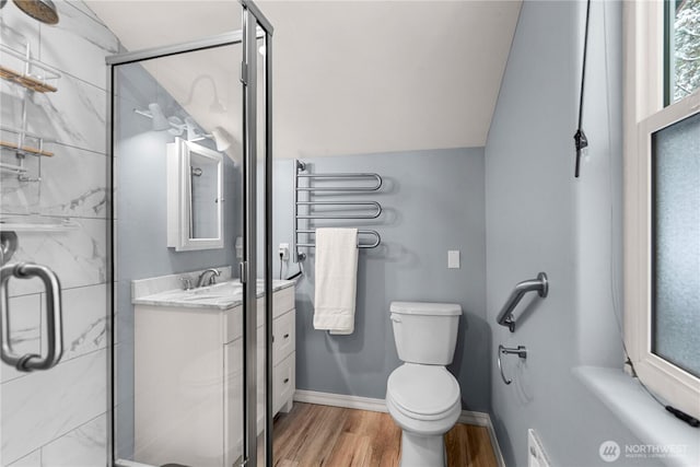11358 River Bend Dr, Leavenworth, WA 98826 - full bath with a marble finish shower, wood finished floors, vanity, and lofted ceiling