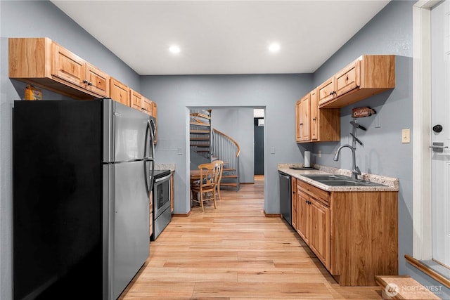11358 River Bend Dr, Leavenworth, WA 98826 - kitchen featuring appliances with stainless steel finishes, light wood finished floors, light countertops, and recessed lighting