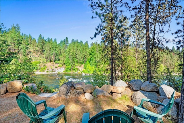 11358 River Bend Dr, Leavenworth, WA 98826 - view of patio / terrace featuring a wooded view