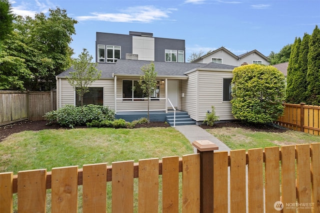6017 Fauntleroy Way SW, Seattle, WA 98136 - view of front of home featuring a fenced backyard and a shingled roof