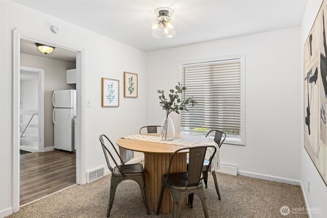 6017 Fauntleroy Way SW, Seattle, WA 98136 - dining space featuring baseboards and carpet