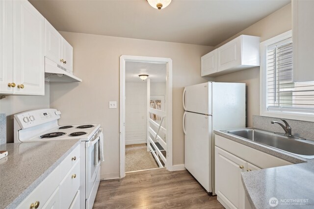 6017 Fauntleroy Way SW, Seattle, WA 98136 - kitchen featuring white appliances, under cabinet range hood, light wood finished floors, and white cabinetry