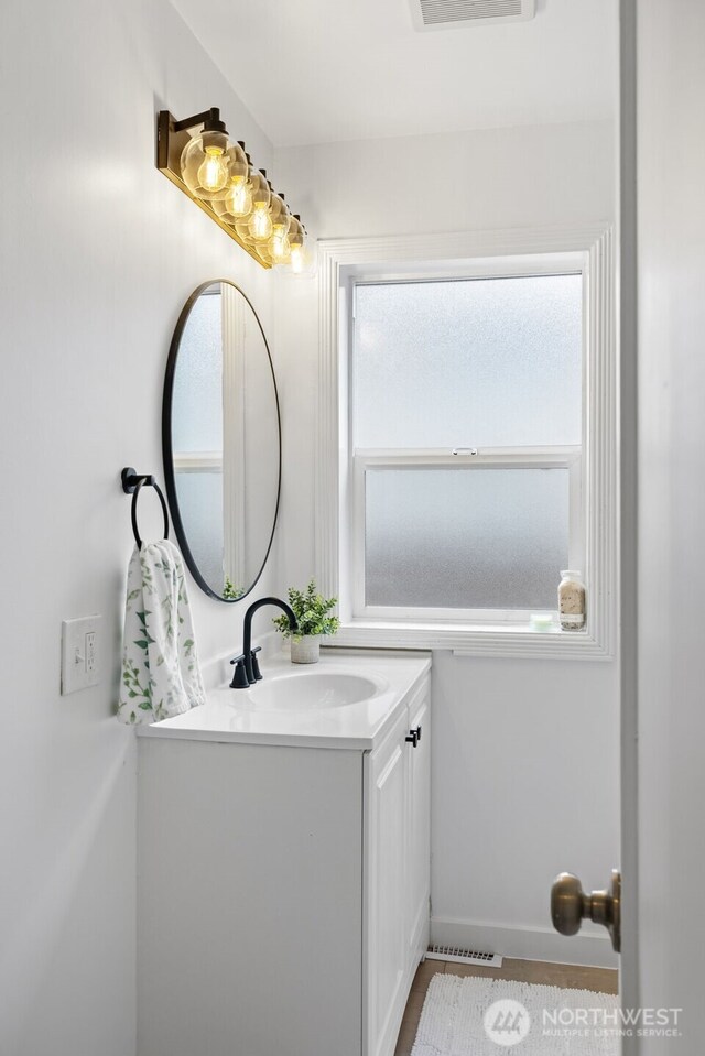 6017 Fauntleroy Way SW, Seattle, WA 98136 - bathroom featuring vanity and healthy amount of natural light