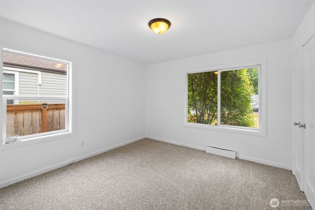 6017 Fauntleroy Way SW, Seattle, WA 98136 - carpeted spare room featuring baseboards