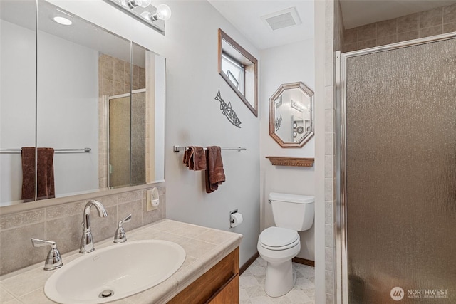 225 NE 19th St Unit 24, East Wenatchee, WA 98802 - bathroom featuring a shower stall, vanity, and backsplash
