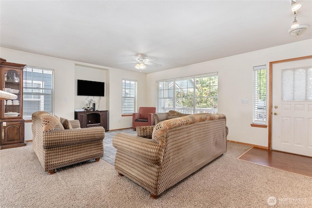 1339 Spruce St, Lynden, WA 98264 - living area with plenty of natural light, light carpet, and a ceiling fan