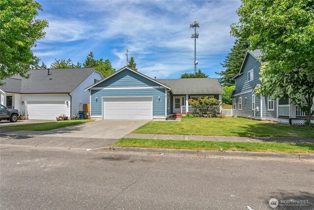 1339 Spruce St, Lynden, WA 98264 - view of front of home featuring a front lawn, a garage, and concrete driveway