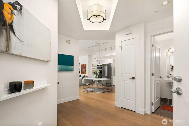 1920 4th Ave Unit 604, Seattle, WA 98101 - corridor with wood finished floors and baseboards