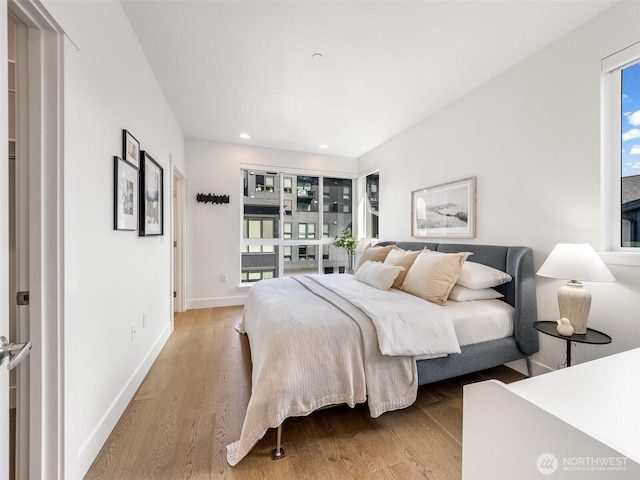 18517 96th Dr NE Unit A, Bothell, WA 98011 - bedroom featuring multiple windows, wood finished floors, and recessed lighting