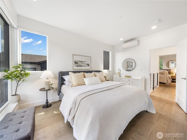 18517 96th Dr NE Unit A, Bothell, WA 98011 - bedroom with an AC wall unit, light wood-type flooring, and recessed lighting