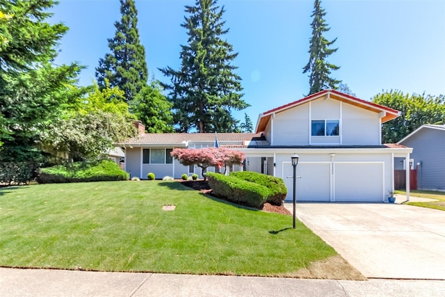 32206 27th Ave SW, Federal Way, WA 98032 - traditional-style home with concrete driveway, an attached garage, a chimney, and a front lawn
