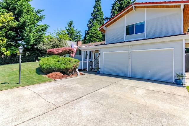 32206 27th Ave SW, Federal Way, WA 98032 - view of front facade featuring an attached garage, concrete driveway, and a front lawn