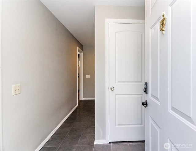 32206 27th Ave SW, Federal Way, WA 98032 - corridor with dark tile patterned floors and baseboards