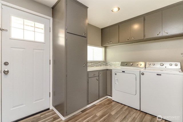 32206 27th Ave SW, Federal Way, WA 98032 - laundry area with cabinet space, independent washer and dryer, and light wood-style flooring