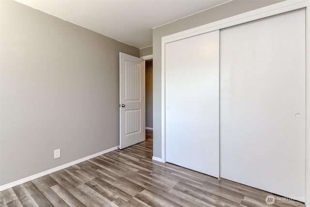 32206 27th Ave SW, Federal Way, WA 98032 - unfurnished bedroom featuring a closet and wood finished floors